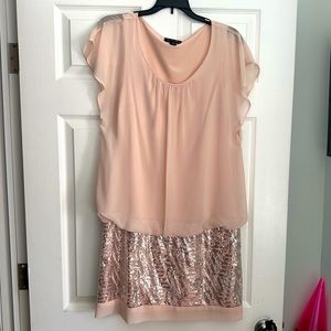 Sleeveless sequined mini dress.